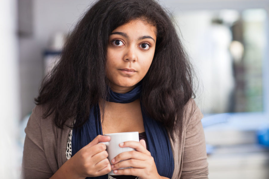young woman holding mug